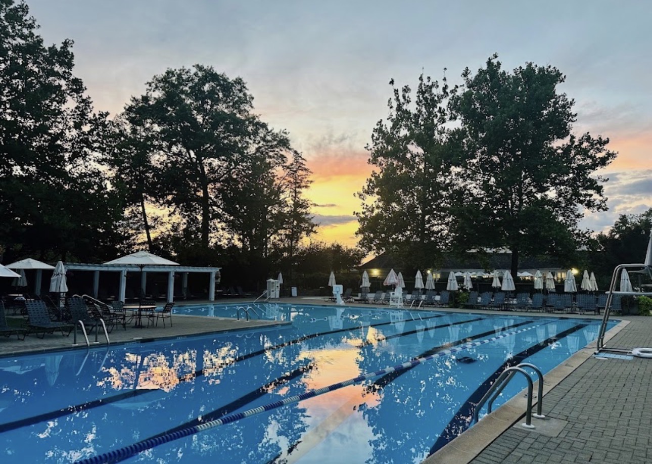 Country club pool reflecting the sunset